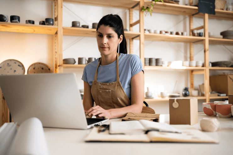 Small business owner working on laptop